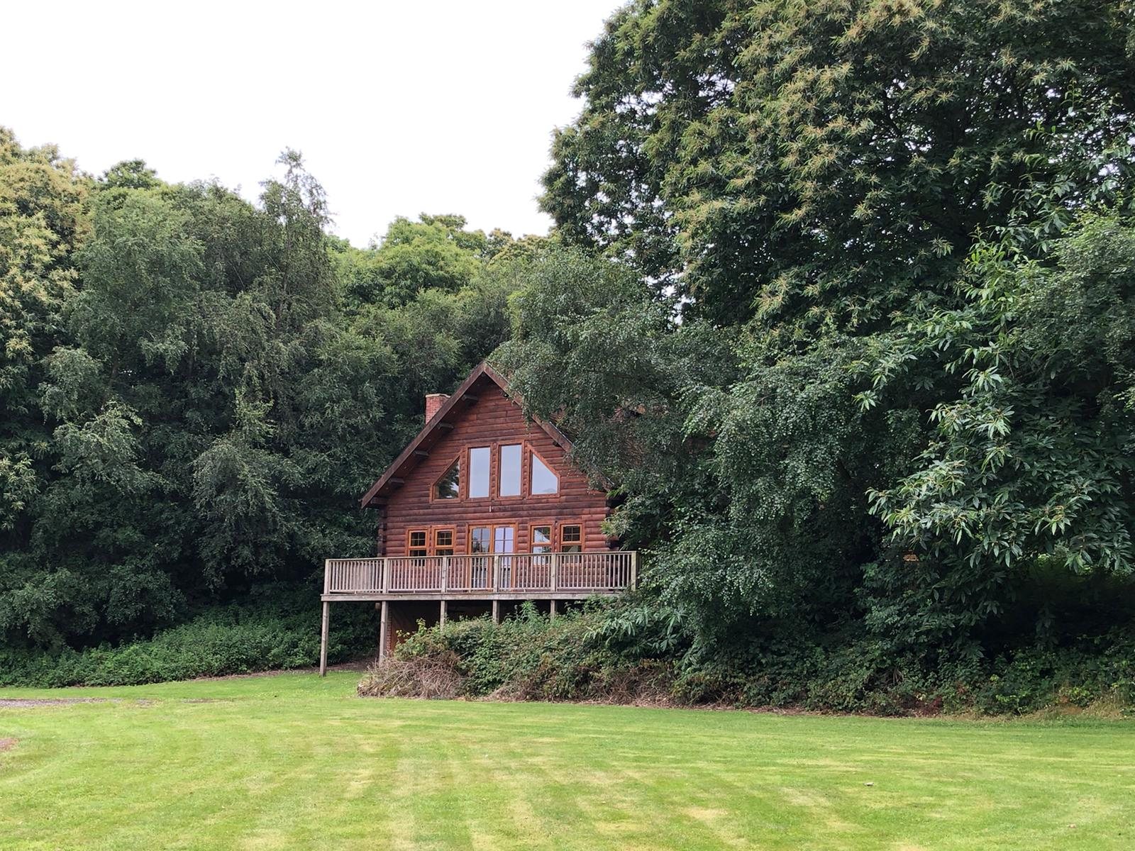 Sherwood Lodge nestled in the woodland at Redbrick